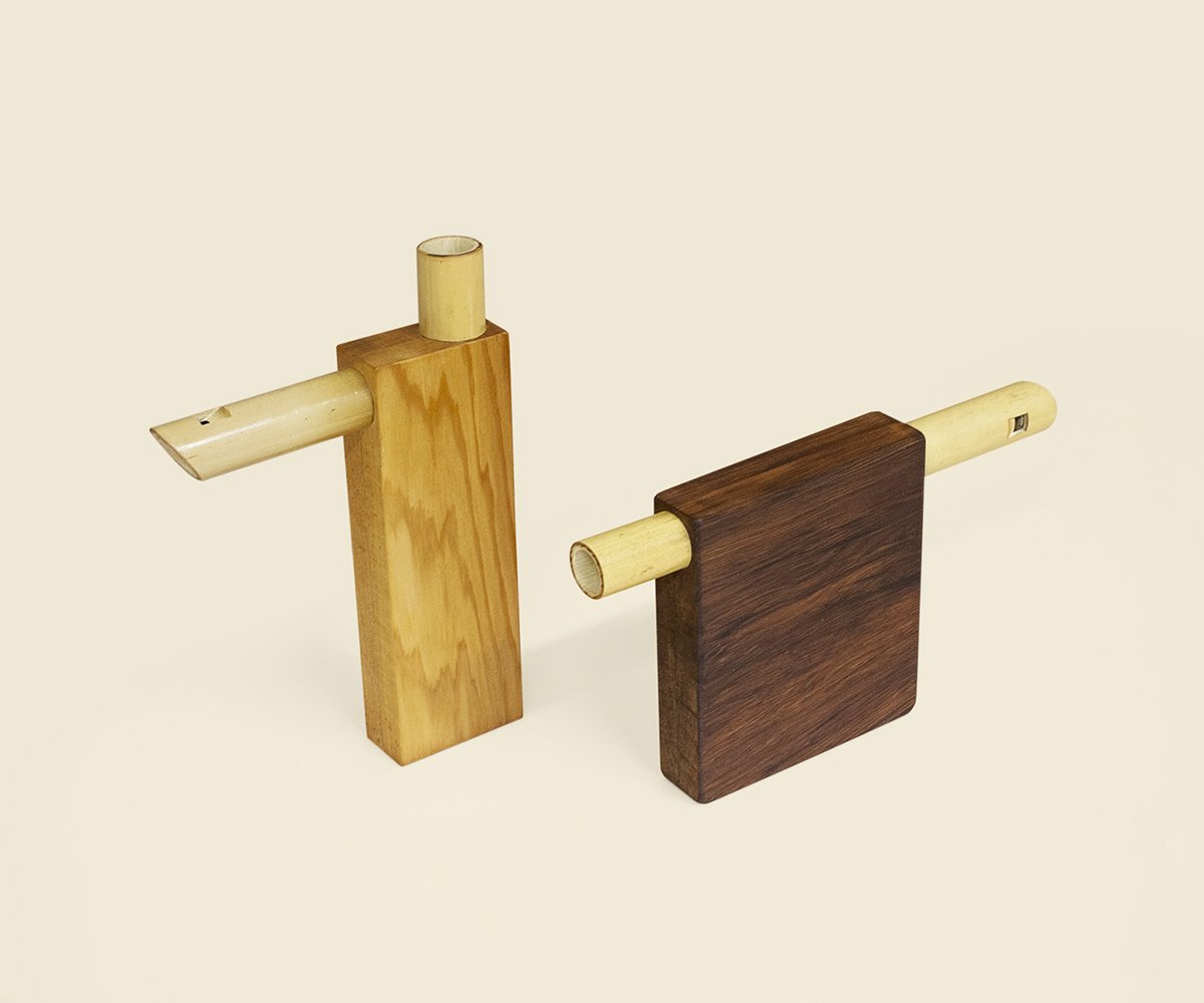 The two Compact flutes from a three-quarter view